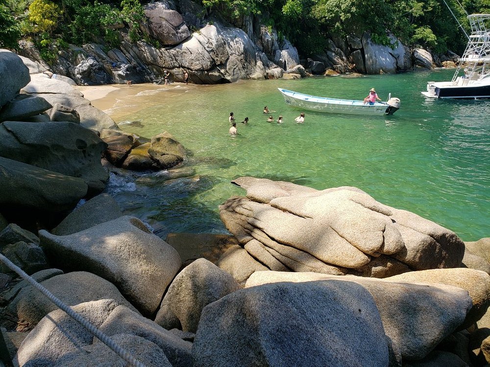 photo of Colomitos Beach showing its small cove surrounded by jungle.